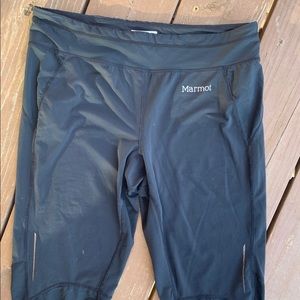 Black leggings. Knee length.